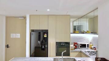 Apartment, 2 Bedrooms | Private kitchen | Coffee/tea maker, full-size fridge, microwave, oven