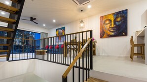A modern interior with a staircase, wooden railing, and artwork on the walls. - Lux 3 bedroom Villa Anagata - near fishing village (ko Samui)