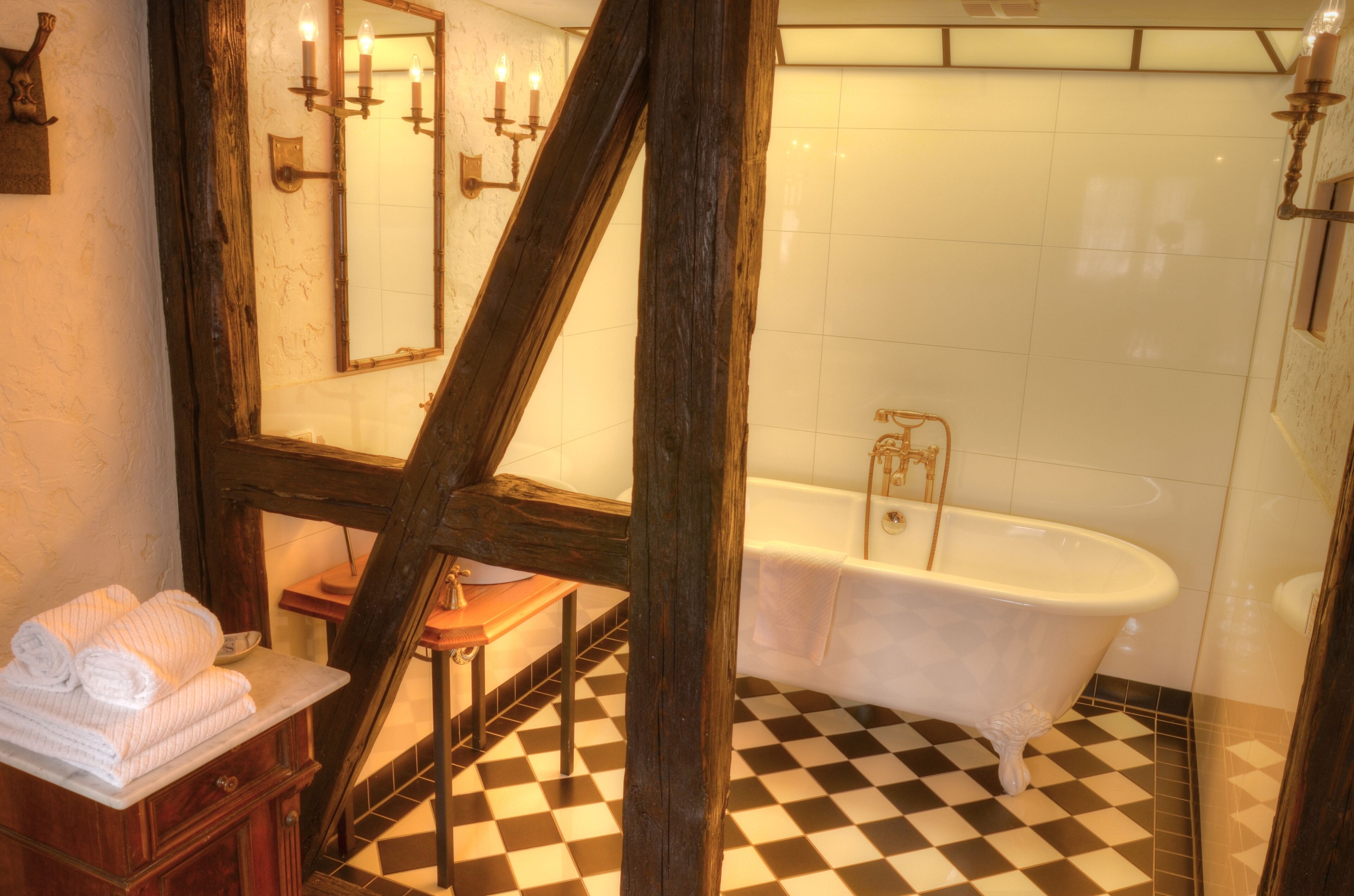 suite (habsberg) | bathroom | deep-soaking bathtub, rainfall showerhead, hair dryer, bathrobes