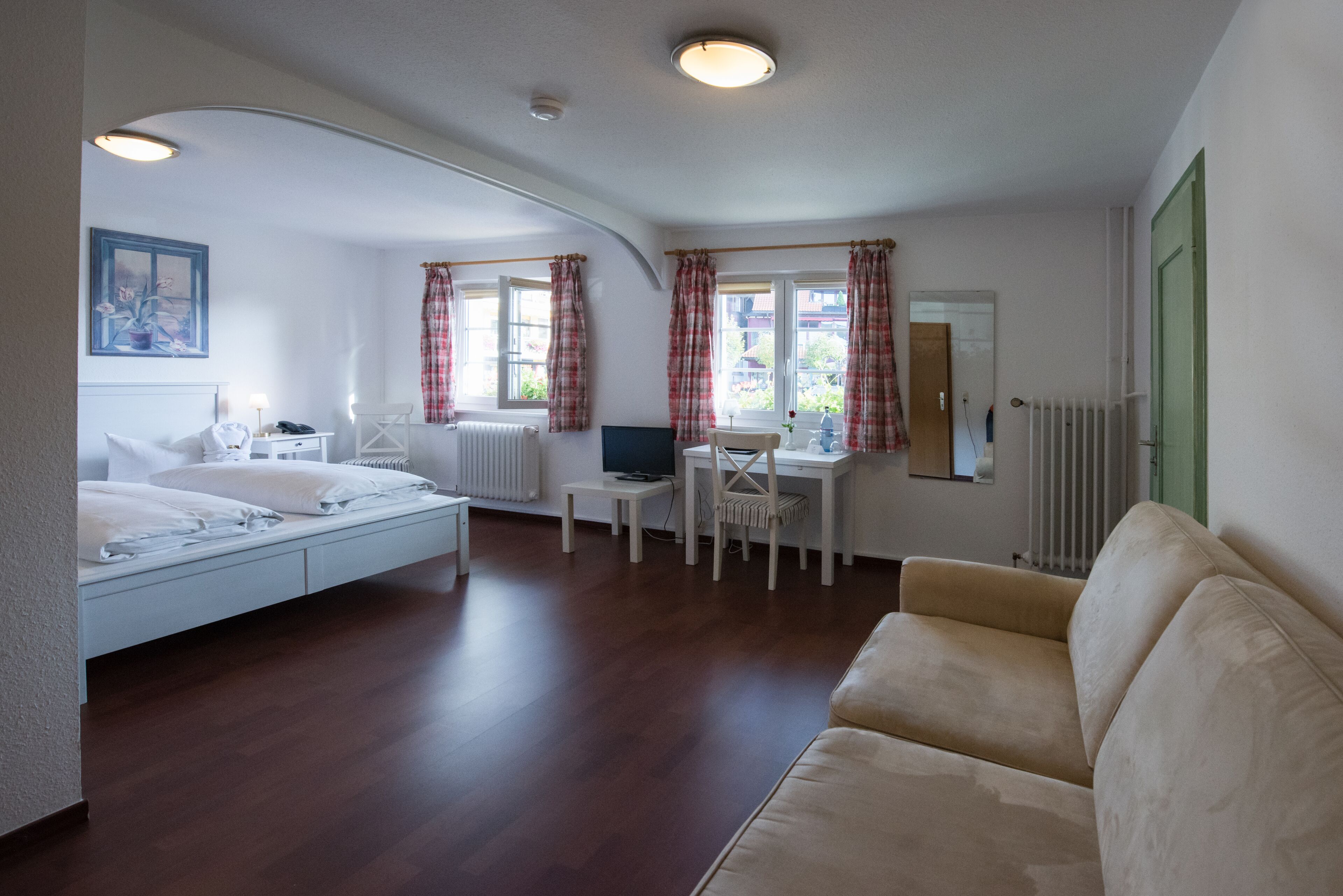 comfort double room | living area | flat-screen tv