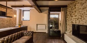 Studiosuite, Erdgeschoss | Wohnbereich | Flachbildfernseher