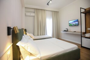 Superior Triple Room, Partial Sea View | 1 bedroom, premium bedding, minibar, soundproofing