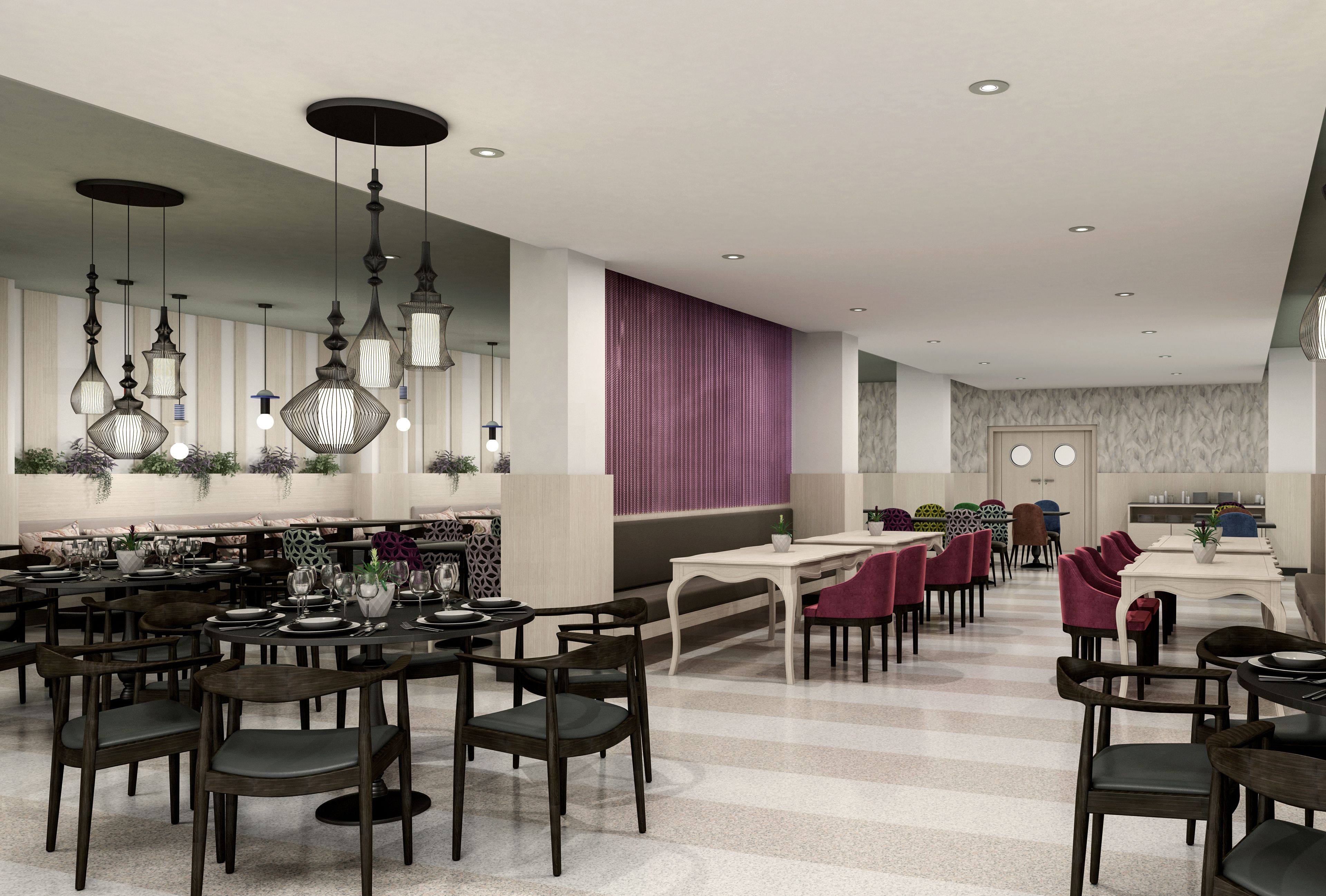 A spacious dining area with multiple tables and chairs, overhead pendant lighting, and a decorative wall panel.