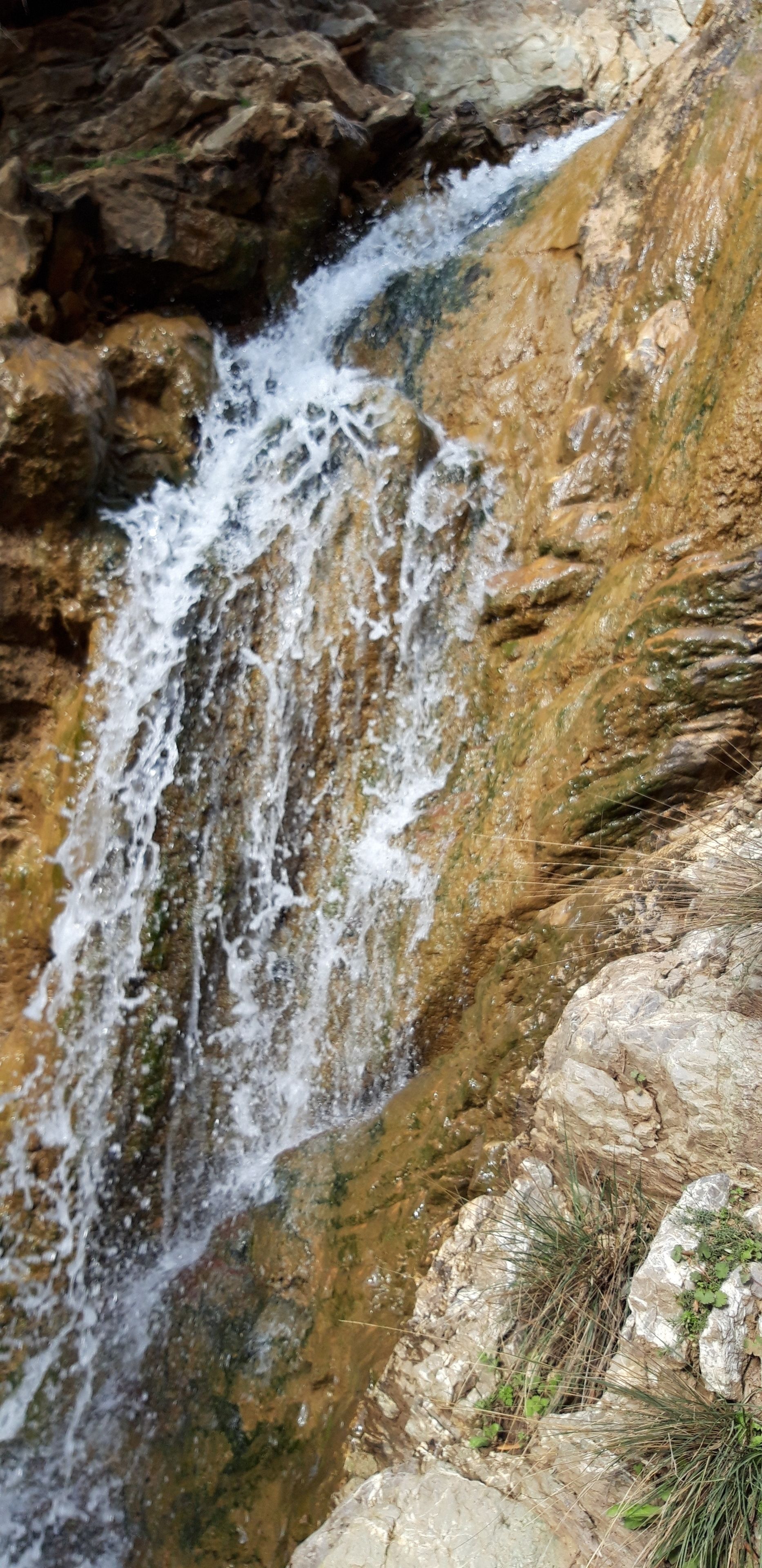 A waterfall cascading over rocky terrain.
