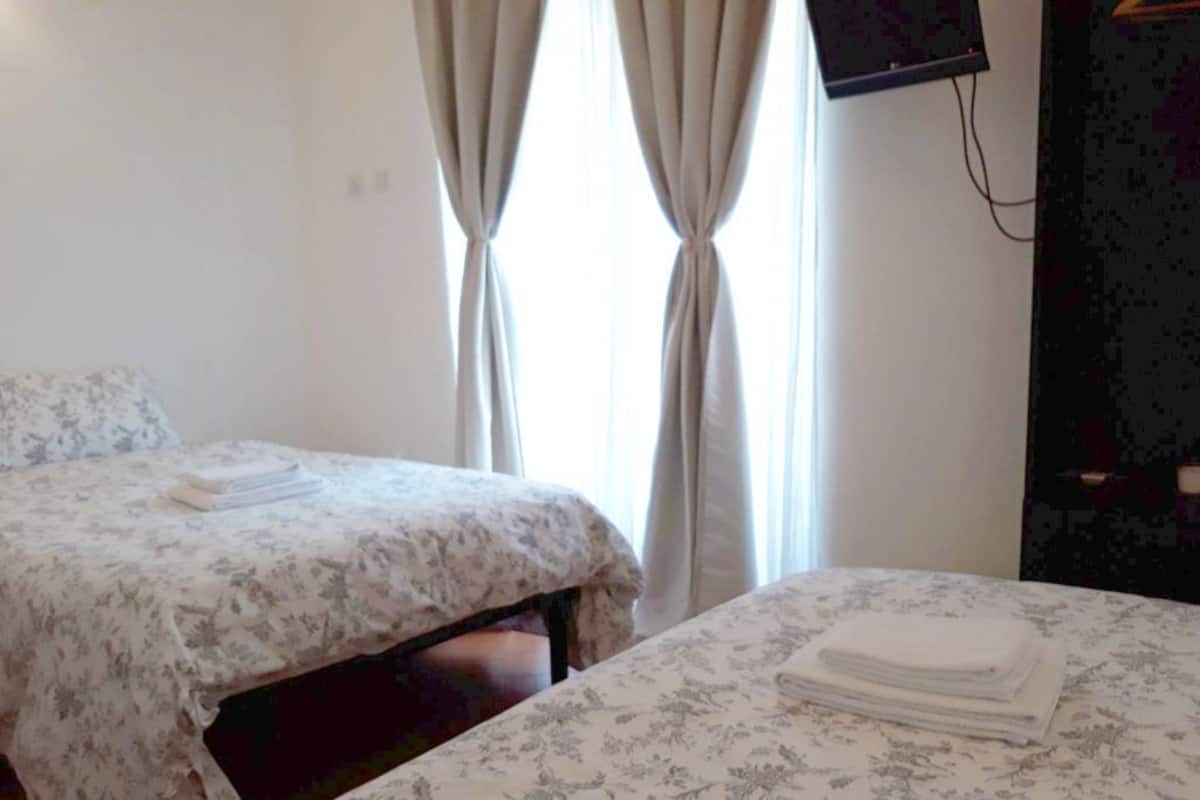 Desk, blackout curtains, soundproofing, free WiFi