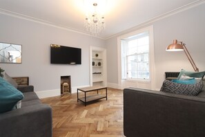 Deluxe Apartment, Multiple Beds | Living room | 49-inch LCD TV with premium channels, TV, Netflix