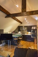 Luxury Apartment | Living area | Flat-screen TV