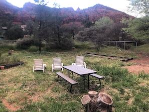 Sit and take in the breathtaking views of the surrounding mountains from this serene outdoor seating area.