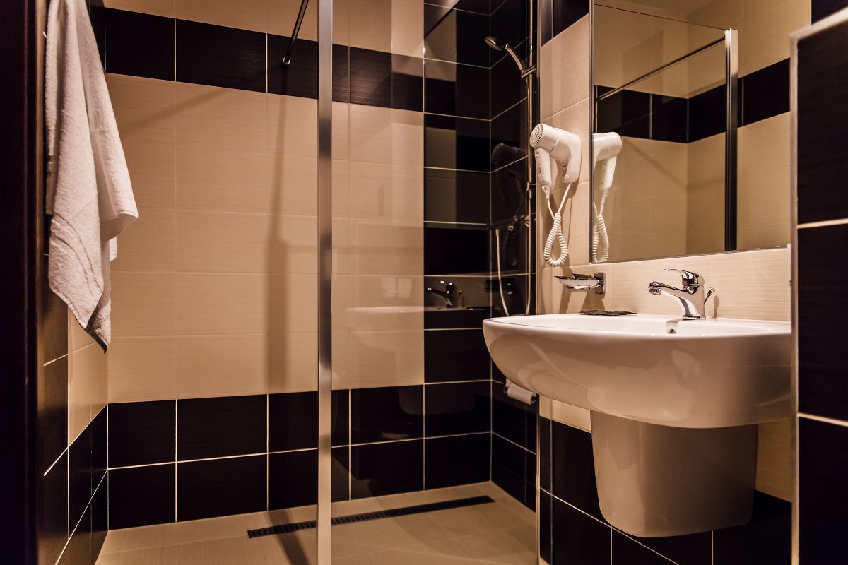 shower, designer toiletries, hair dryer, towels