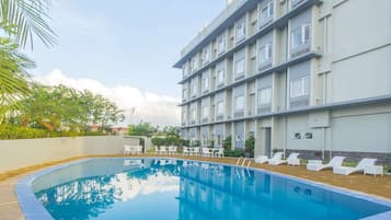Outdoor pool, open 7:00 AM to 9:00 PM, pool umbrellas, sun loungers