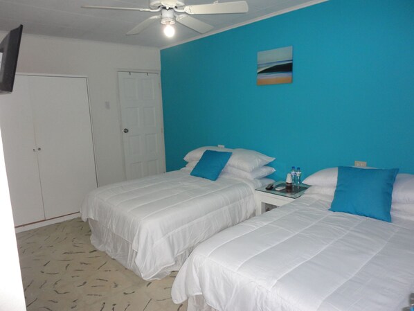 Basic Quadruple Room, 2 Double Beds, Private Bathroom | Individually decorated, individually furnished, blackout curtains