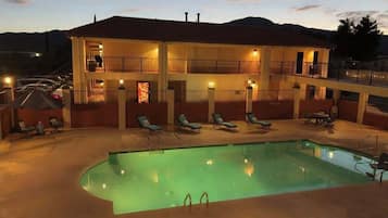 Seasonal outdoor pool, open 8:00 AM to 10:00 AM, pool loungers