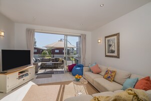 Deluxe Apartment, 3 Bedrooms | Living area | 43-inch flat-screen TV with digital channels, TV