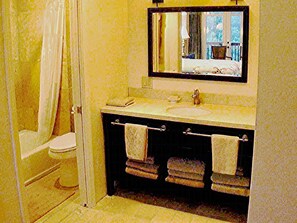 Combined shower/tub, hair dryer, towels, soap