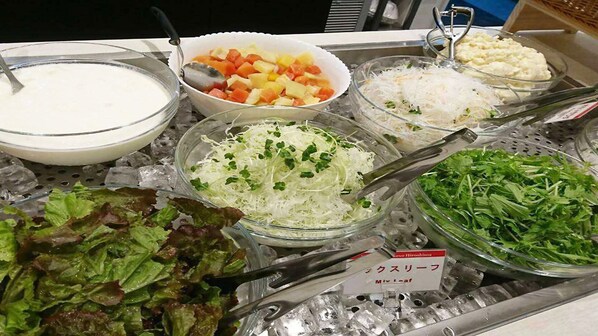 A buffet with various food items including mixed vegetables, coleslaw, and a salad. - Hotel Kuretakesou Hiroshima Otemachi (Hiroshima)