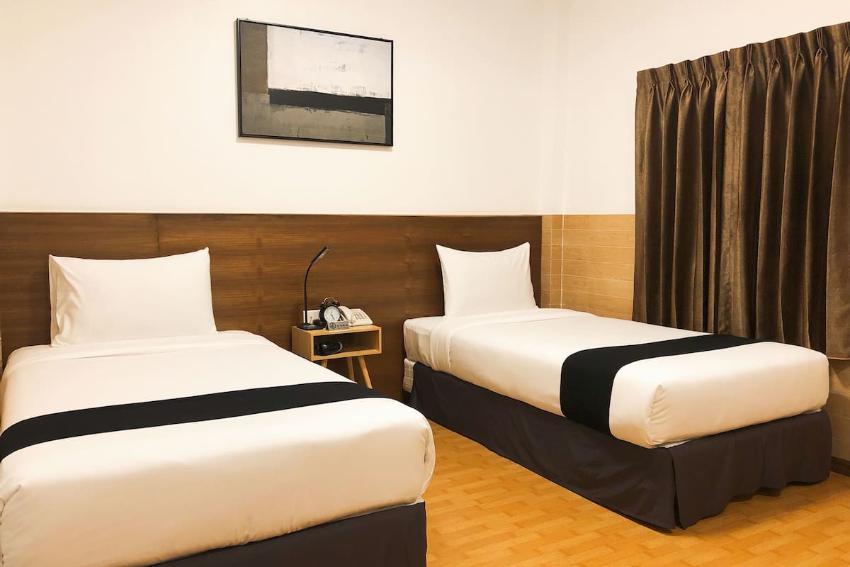 superior twin room | minibar, in-room safe, desk, blackout curtains