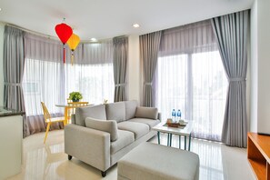 1 Bedroom Serviced Apartment | Living area | 32-inch flat-screen TV with cable channels, TV - Sunflower Boutique Studio Apartment (Ho Chi Minh City)