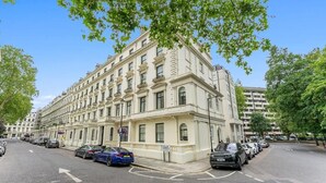 A multi-story building with a classic architectural style, featuring a symmetrical facade with evenly spaced windows and decorative elements. - Cleveland Residences Paddington (London)