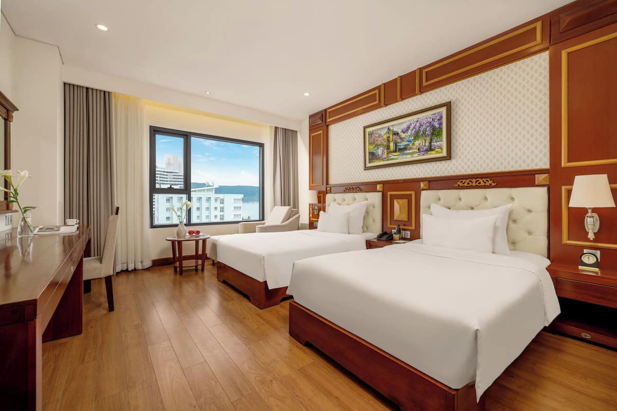 Deluxe Twin Room, Partial Ocean View | In-room safe, desk, blackout drapes, soundproofing
