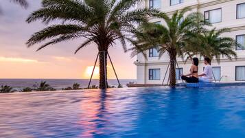 2 outdoor pools, pool umbrellas, pool loungers