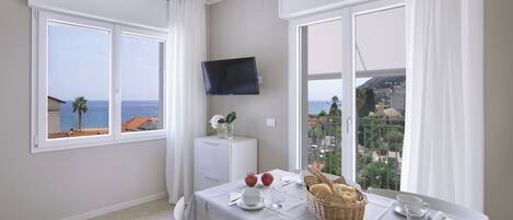 Comfort Apartment, 1 Bedroom, Balcony, Sea View | Living area | Flat-screen TV