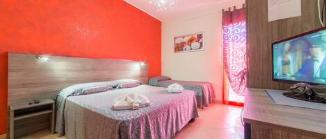 Deluxe Triple Room | Individually decorated, individually furnished, desk, blackout drapes