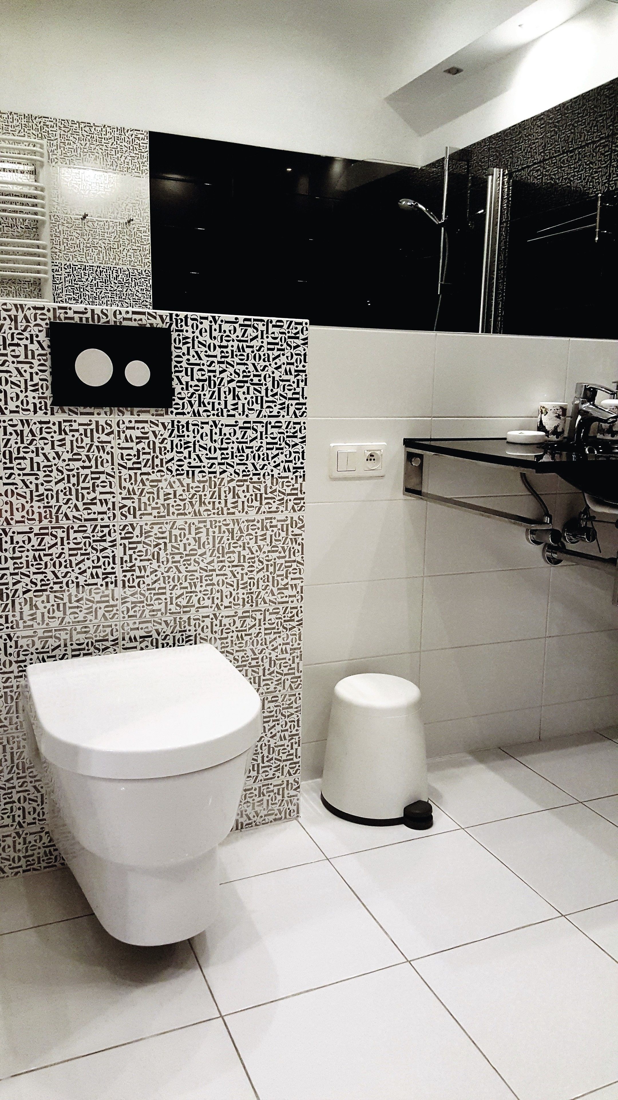 A bathroom with a toilet, a bidet, and a sink.