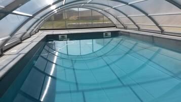 Seasonal outdoor pool, open 11:30 AM to 7:30 PM, pool umbrellas