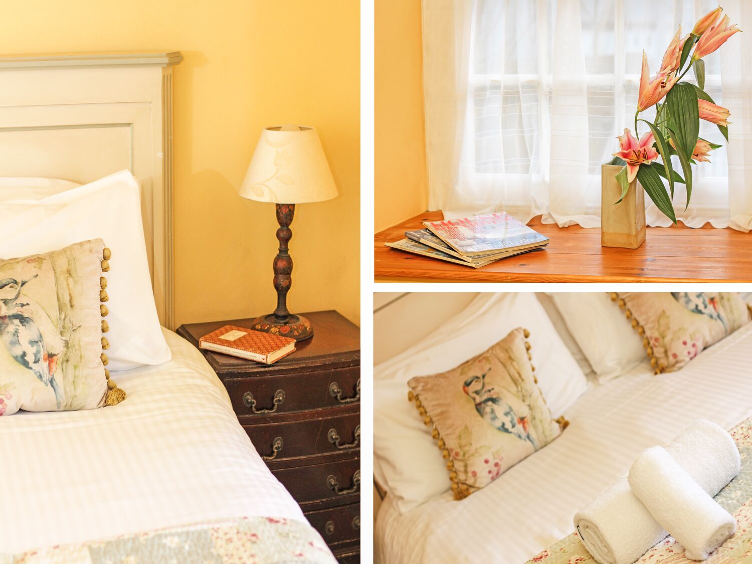 A neatly made bed with a pillow, a bedside lamp, and a small wooden chest.