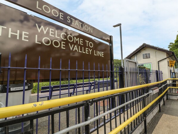 Welcome to the Looe Valley Line station, offering a ticket office and payphone for travelers.