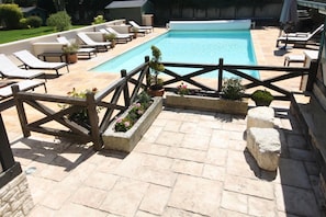 Seasonal outdoor pool, pool loungers