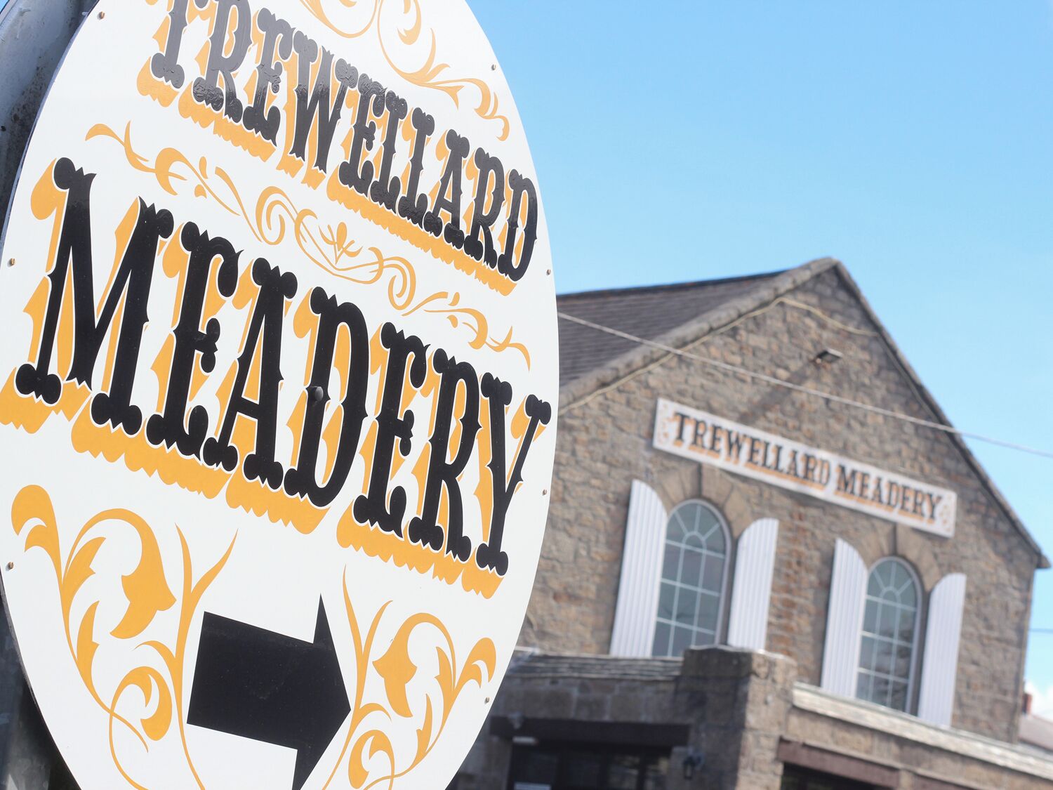 A sign for Trewellard Meadery with a directional arrow.