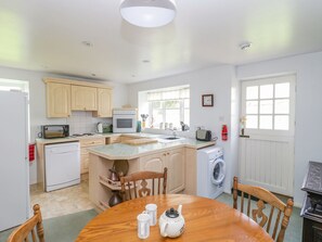 Enjoy meals in the self-contained kitchen with microwave, oven, and dishwasher.