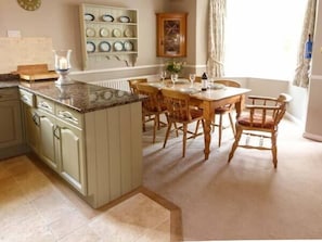 Enjoy meals at the central dining table with comfortable seating.