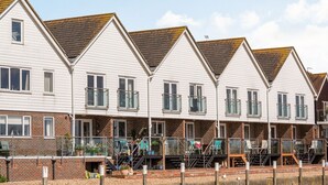 A row of white buildings with brick facades and dormer windows. - 16 The Boathouse (Rye)