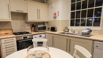 Cottage | Private kitchen | Dishwasher, highchair, cookware/dishes/utensils