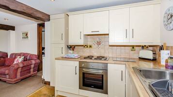 Cottage | Private kitchen | Stovetop, high chair, cookware/dishes/utensils