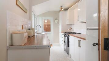 Cottage | Private kitchen | Microwave, stovetop, highchair, cookware/dishes/utensils