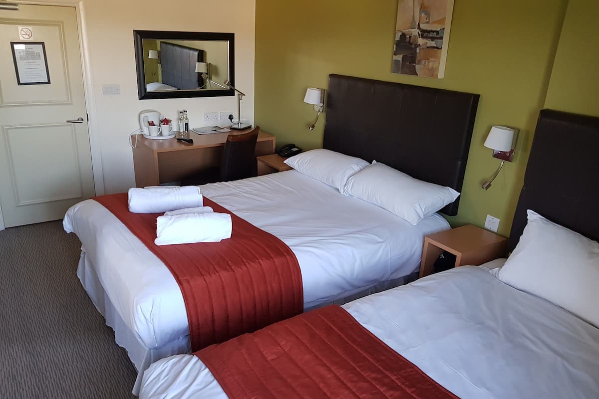 Select Comfort beds, desk, laptop workspace, iron/ironing board