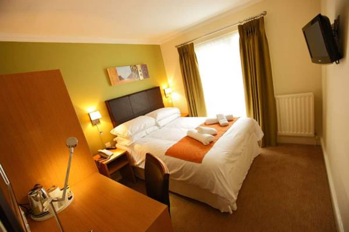 Select Comfort beds, desk, laptop workspace, iron/ironing board