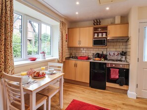 Cottage | Private kitchen | Fridge, microwave, stovetop, high chair