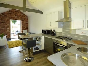 Enjoy cooking in this kitchen with oven, gas stove, and ample counter space.