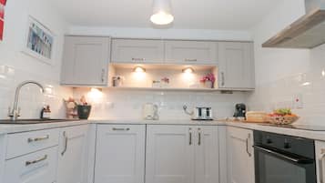 Cottage | Private kitchen | Microwave, stovetop, dishwasher, highchair