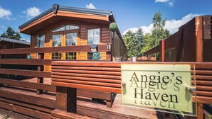 A wooden cabin with a sign reading "Angie's Haven." - Angie's Haven (Morpeth)