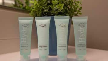 Four Hydra Spa products: shampoo, body cream, conditioner, and body wash.