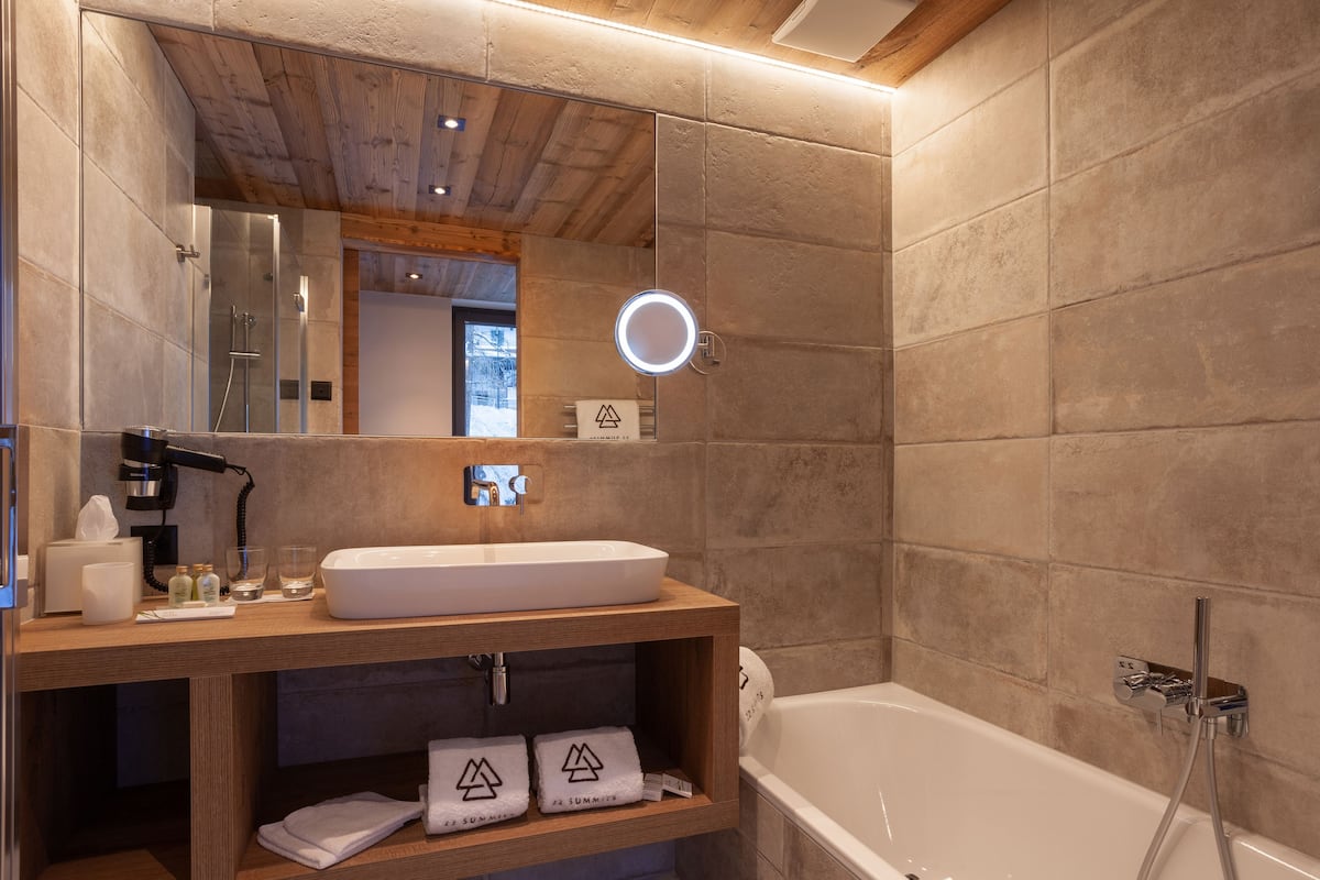 panoramic suite, mountain view | premium bedding, minibar, in-room safe, desk