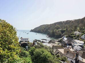 A coastal town with buildings, a bay, and boats. - Cousham Cottage (Torpoint)