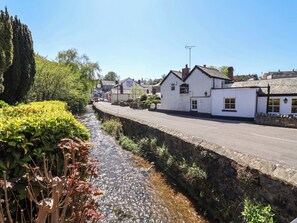 A white building with a sign that reads 'The Inn of the Town.' - Ty Cerrig (Rhyl)