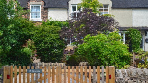 A gated entrance with a sign reading "17 Riverside". - 17 Riverside (Stoke-on-Trent)