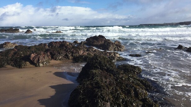 A rocky beach with waves crashing onto the shore. - Sea Spray (Eyemouth)